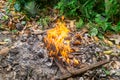 bonfire set in daytime to get rid of rubbish in stack, Fire glowing in garbage stack to keep clean