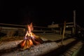 Bonfire with sparks and particles. Small campfire with gentle flames in night. Night campfire with available space. Bonfire burnin Royalty Free Stock Photo