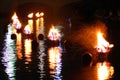 Bonfires burn on the river Royalty Free Stock Photo