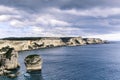 BONIFACIO, FRANCE - APRIL 8, 2023: Corsaire boat with tourists in front of limestone coast