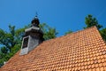 Bonin, zachodniopomorskie / Polska - June 28, 2019: A small red brick church. Temple with a wooden tower in Central Europe