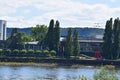 Bonn, Germany - 06 28 2022: Plenarsaal and Bundeshaus at the Rhine with nstruction cranes in background