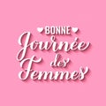 Bonne Journee des Femmes - Happy Womens Day in French. Calligraphy hand lettering on pink background. International