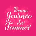 Bonne Journee des Femmes - Happy Womens Day in French. Calligraphy lettering on hot pink background with bokeh