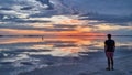 Bonneville - Man walking into the sunset of lake Bonneville Salt Flats, Wendover, Western Utah, USA, America Royalty Free Stock Photo