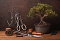 bonsai tree pruning tools and wire on a wooden surface