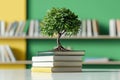Bonsai tree sits atop a stack of books in a library setting Royalty Free Stock Photo