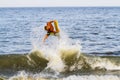 Boogie boarding teen in the surf and waves in the Atlantic ocean at Bethany Beach Delaware. Royalty Free Stock Photo