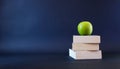 Book and apple on blank table Royalty Free Stock Photo