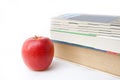 Book and apple on white backgound