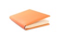 Book with blank orange cover on white Royalty Free Stock Photo