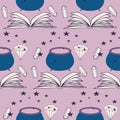 Book, cauldrom and magic elements in a seamless pattern design Royalty Free Stock Photo