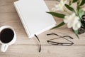 Book, coffee cup, glasses on a table. Reading, leisure, social distance, learning, hobby concept Royalty Free Stock Photo