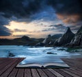 Book concept Beautiful landscape of mountains and sea at sunset