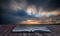 Book concept Beautiful sunset long exposure image over ocean Royalty Free Stock Photo