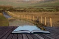 Book concept Landscape image of flooded country lane in farm