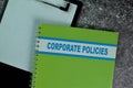 The Book of Corporate Policies on the table. Business concept