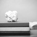 Book and crumpled paper black and white color tone style Royalty Free Stock Photo