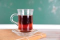 A book and a cup of black tea in front of the blackboard Royalty Free Stock Photo