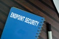 The book of Endpoint Security isolated on Wooden Table