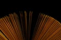 Book fanned pages in dark room Royalty Free Stock Photo