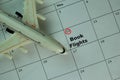 Book Flights on monthly Calendar and marked 10th isolated on office desk