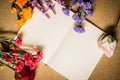 Book and flowers on wooden table