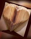 Book folding art heart shaped Royalty Free Stock Photo