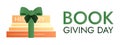 Book Giving Day. Stack books, green ribbon, bow. History encyclopedia. Donate literature. Textbook gift. Card holiday Royalty Free Stock Photo