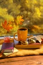 book with glasses, cup of coffee, autumn leaves, wool sweater