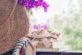 Book, glasses, cup of tea and lilac on a wooden window. Fragrant tea in the garden. Romantic concept Royalty Free Stock Photo