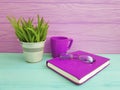 Book glasses pot with grass pink cup of coffee vintage on table wooden concept Royalty Free Stock Photo