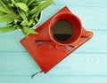 Book glasses pot with grass cup of coffee vintage on table wooden concept Royalty Free Stock Photo