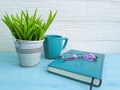 Book glasses pot with plant cup of coffee vintage on table wooden concept Royalty Free Stock Photo