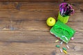 Book, glasses and school supplies. Wooden background. Top view. Royalty Free Stock Photo