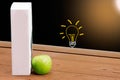 Book and Green apple on chalkboard background. Royalty Free Stock Photo