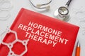 Book about hormone replacement therapy and molecule models. Royalty Free Stock Photo