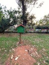 A book house set within a public park surrounded by trees, foliage and grass Royalty Free Stock Photo