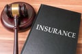 Book with insurance laws. Justice and legislation concept Royalty Free Stock Photo