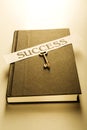 Book, key & success label Royalty Free Stock Photo