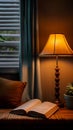 Book beside lamp cozy ambiance, perfect for evening reading