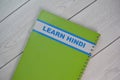 The book of Learn Hindi isolated on Wooden Table