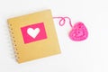 Book Of Love With Pink Crochet Heart On White Background
