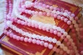 Book of magic spells with pink agate and crystal quartz mineral stone beads