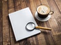 Book, magnifier, coffee cup