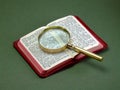 Book and Magnifying Glass