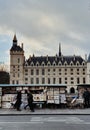 The book market at the Seine river bank, view of the Parisians life style and the Conciergerie buliding, Paris, France