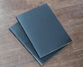 Book mockup blank black A4 leather cover for magazine, booklet, brochure, menu, diary mock-up design template on wooden table Royalty Free Stock Photo