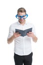Book nerd wearing cute glasses. Man with book. Study hard. Teacher funny guy. Male student reading. Student handsome Royalty Free Stock Photo