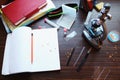 Book, notebooks , pen , pencil and microscope on the table